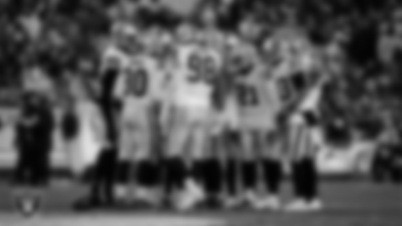 The Las Vegas Raiders defense huddles during the regular season away game against the Pittsburgh Steelers at Acrisure Stadium.