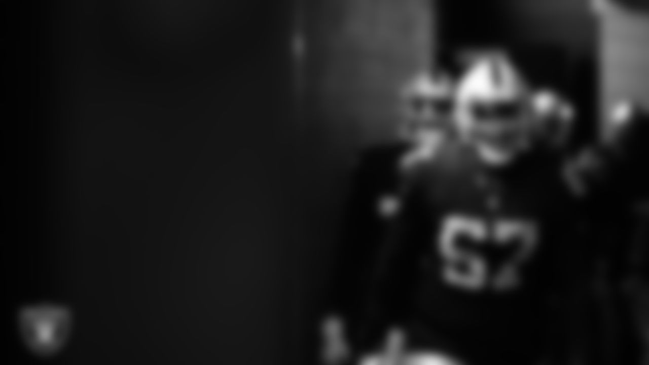 Las Vegas Raiders guard Lester Cotton Sr. (67) walks down the tunnel before the preseason home game against the Minnesota Vikings at Allegiant Stadium