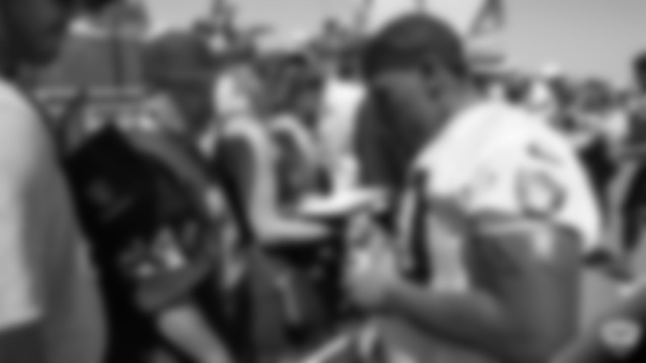 Oakland Raiders running back Jalen Richard (30) signs autographs for fans after practice at 2019 Training Camp.