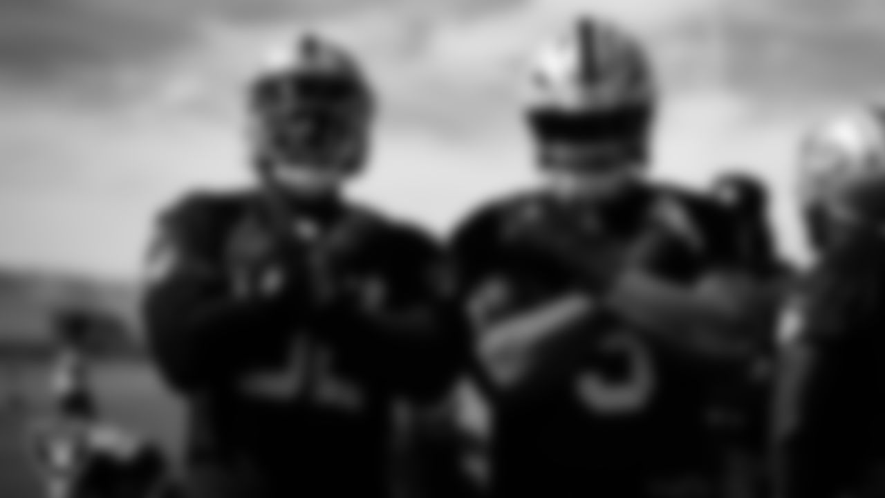 Las Vegas Raiders defensive lineman David Agoha (62) and defensive end Tyree Wilson (9) during practice at Intermountain Health Performance Center.