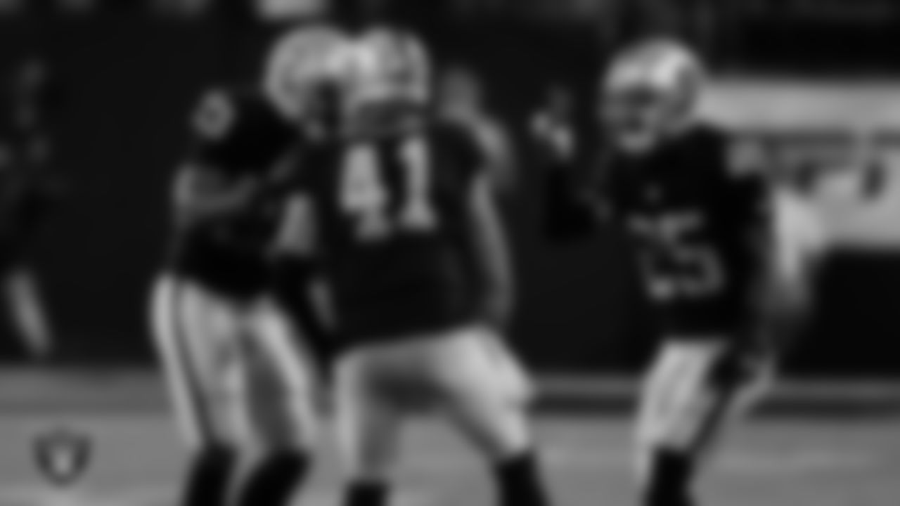 Las Vegas Raiders safety Roderic Teamer (33), linebacker Robert Spillane (41) and safety Tre'von Moehrig (25) during the regular season home game against the Green Bay Packers at Allegiant Stadium.