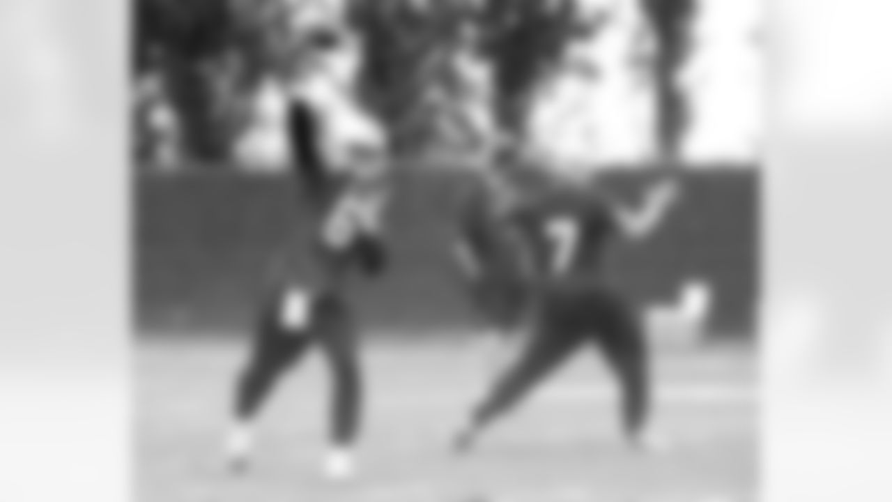The QBs work on their passing form during individuals.