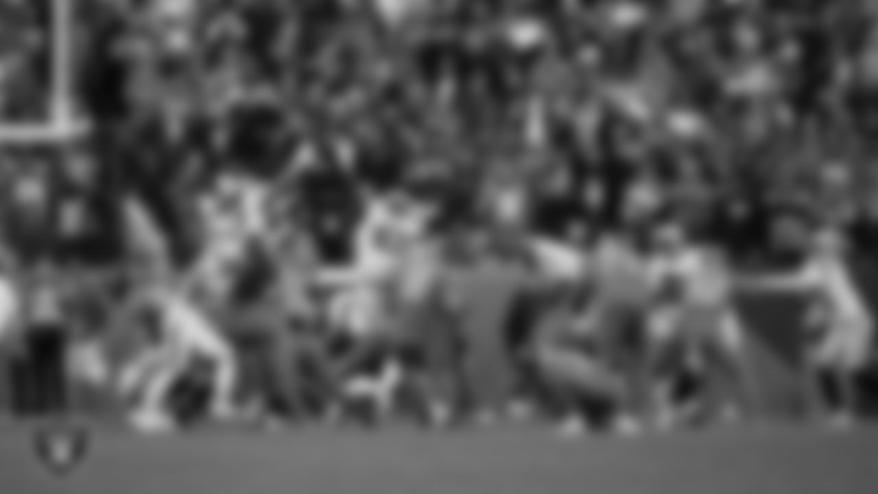 Las Vegas Raiders defensive end Maxx Crosby (98) blocks a field goal attempt during the regular season away game against the Denver Broncos at Empower Field at Mile High.