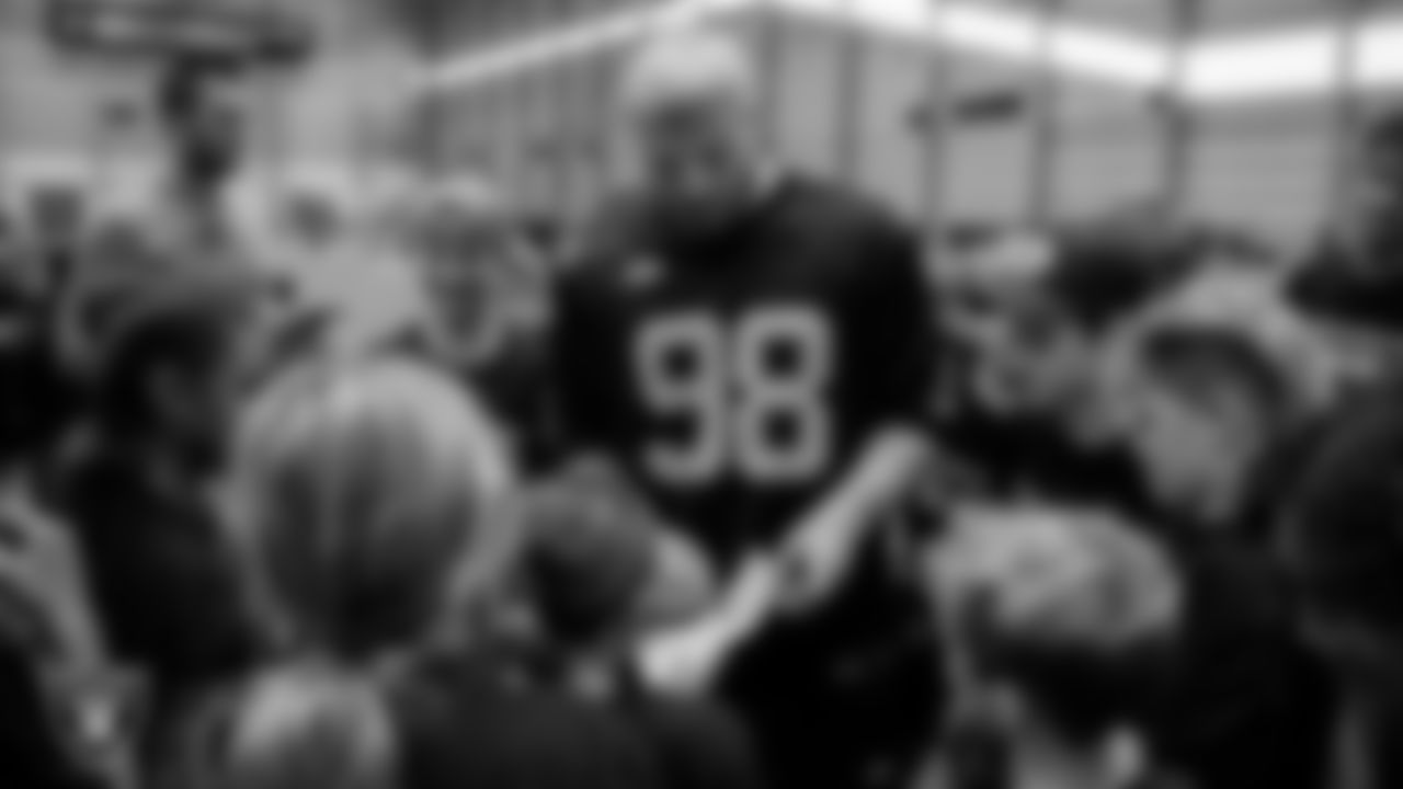 Las Vegas Raiders defensive end Maxx Crosby (98) signs autographs during the Raiders Skills Camp.
