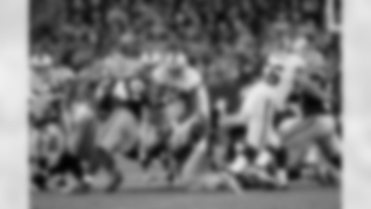 RB Michael Bush rushes up the middle.
