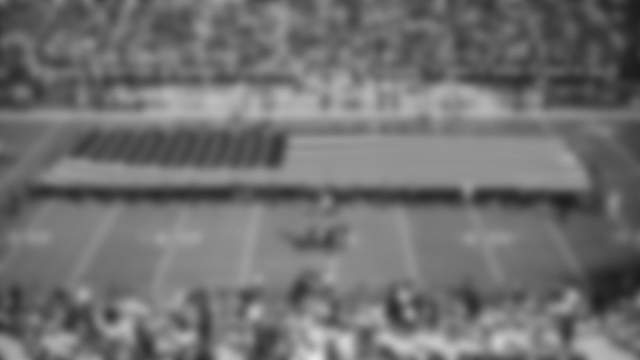 The American flag is displayed by season ticket members on the field during the national anthem before the Raiders regular season game against the Detroit Lions.