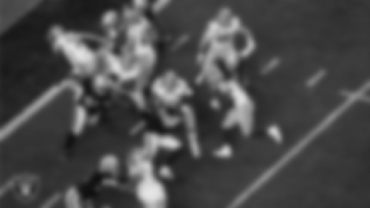 Las Vegas Raiders defensive end Maxx Crosby (98) makes a tackle during the regular season home game against the San Francisco 49ers at Allegiant Stadium.