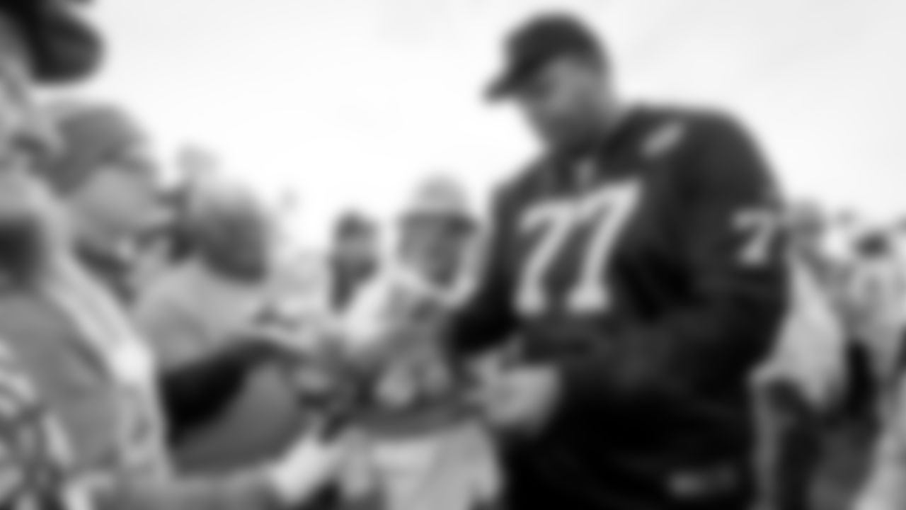 Raiders tackle Trent Brown (77) signs autographs for construction workers following an official announcement of the Raiders changing their name to the Las Vegas Raiders.