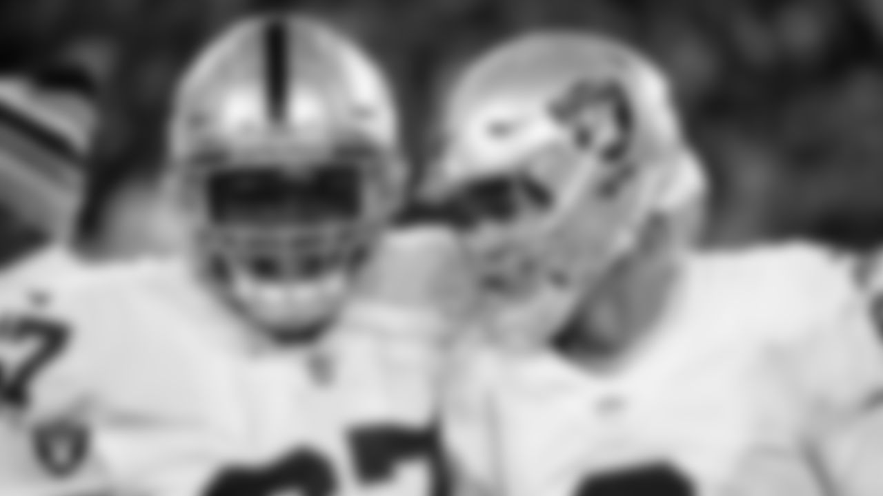 Las Vegas Raiders guard Lester Cotton Sr. (67) and kicker Daniel Carlson (2) celebrate after Carlson made a game-winning 48-yard field goal during the regular season away game against the Cleveland Browns.