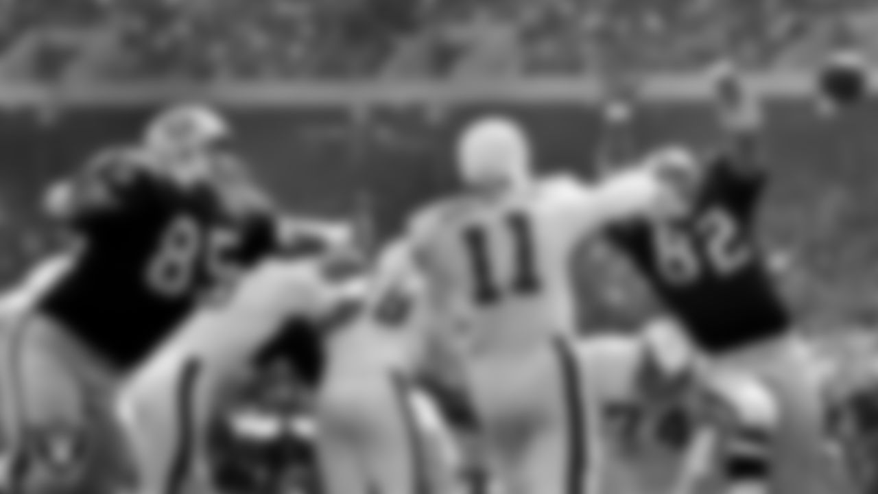 Oakland Raiders defensive tackle Carleton Oats (85) and defensive end Horace Jones (82) pressures the quarterback during the regular season home game against the Philadelphia Eagles at Oakland–Alameda County Coliseum, Sunday, October 17, 1971, in Oakland, Calif.