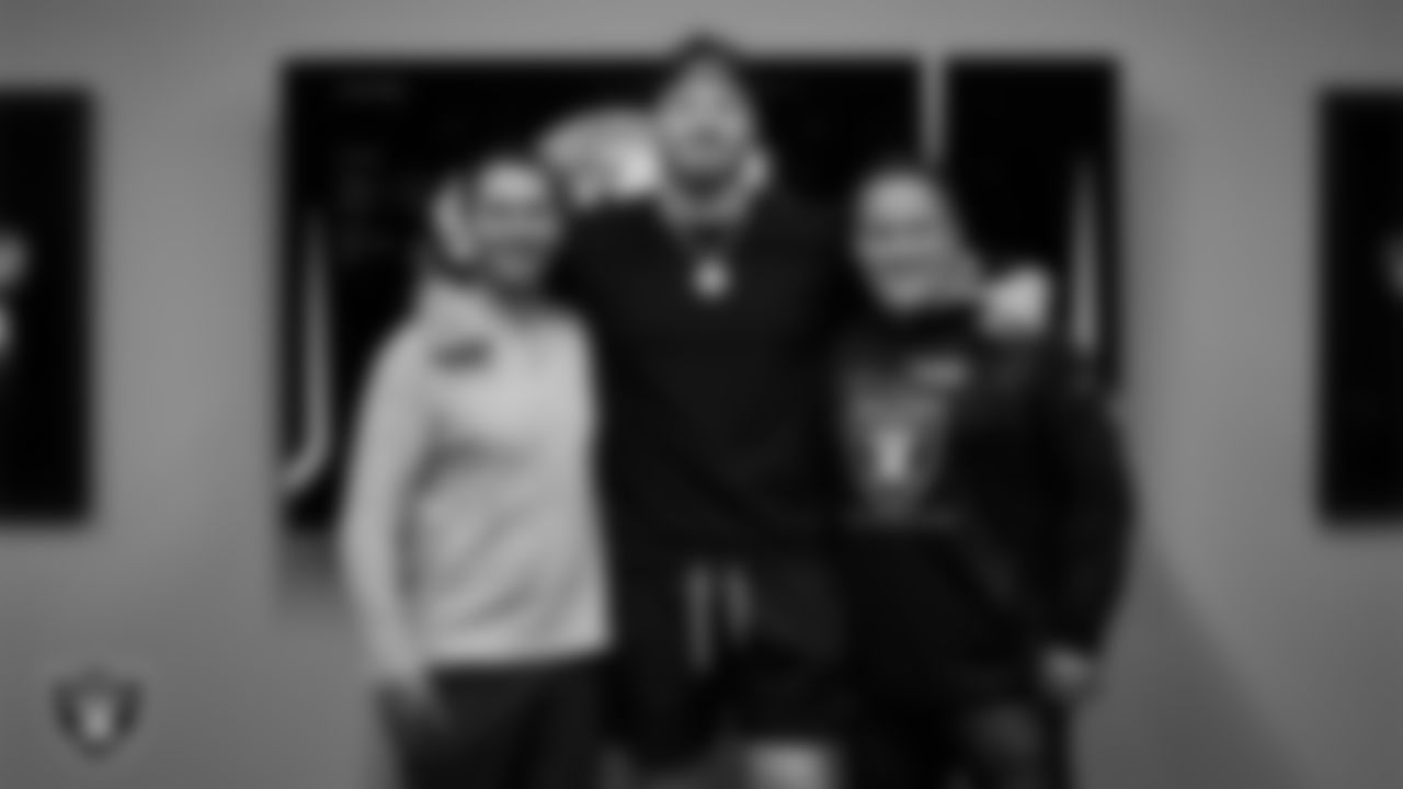 Las Vegas Raiders defensive end Maxx Crosby with General Manager Dave Ziegler and Head Coach Josh McDaniels before signing a contract extension.