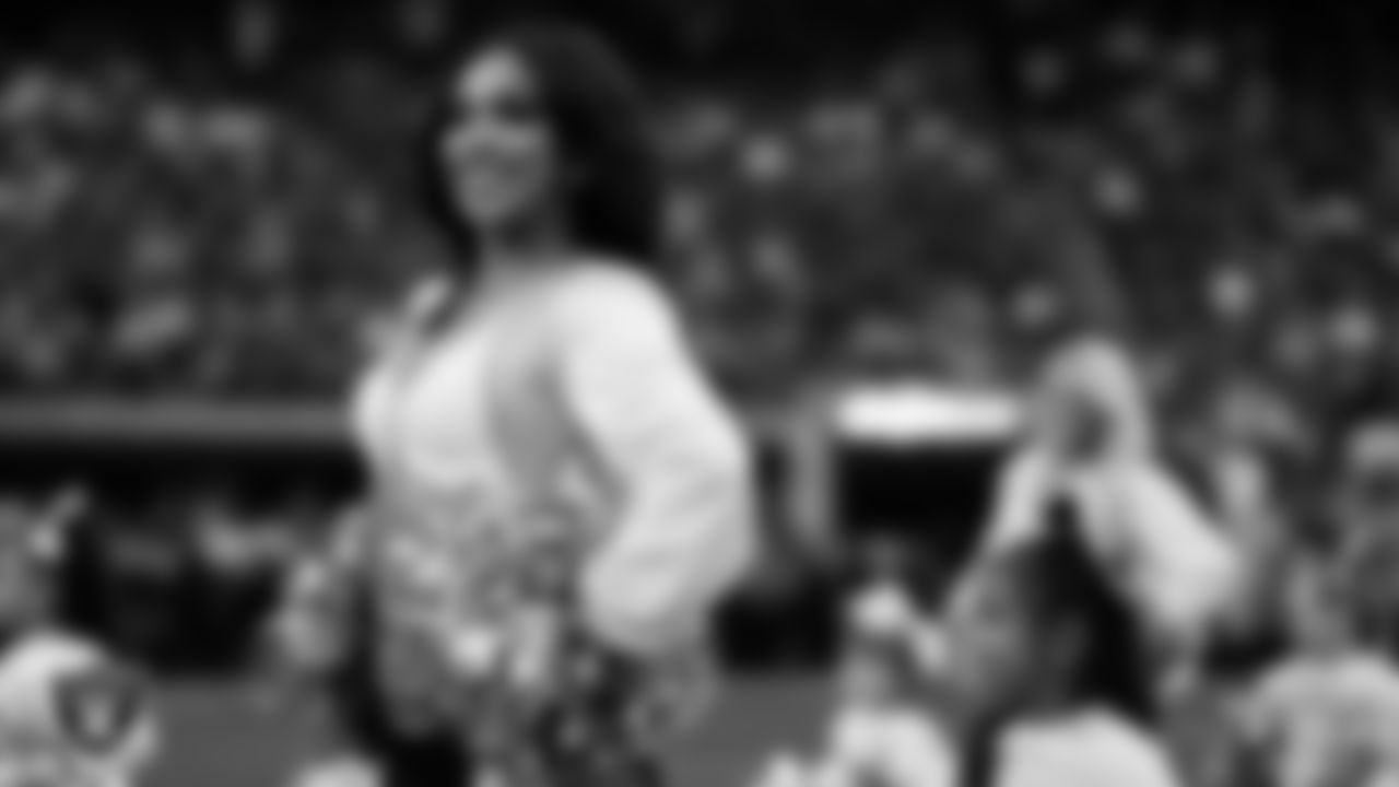 Raiderette Cierra and Junior Raiderettes perform on the field before the regular season home game against the Los Angeles Chargers at Allegiant Stadium.