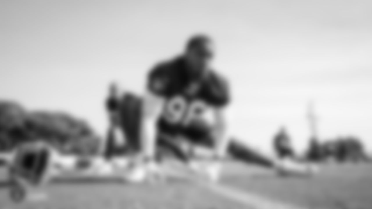 Raiders defensive end Clelin Ferrell (96) warms up during practice.