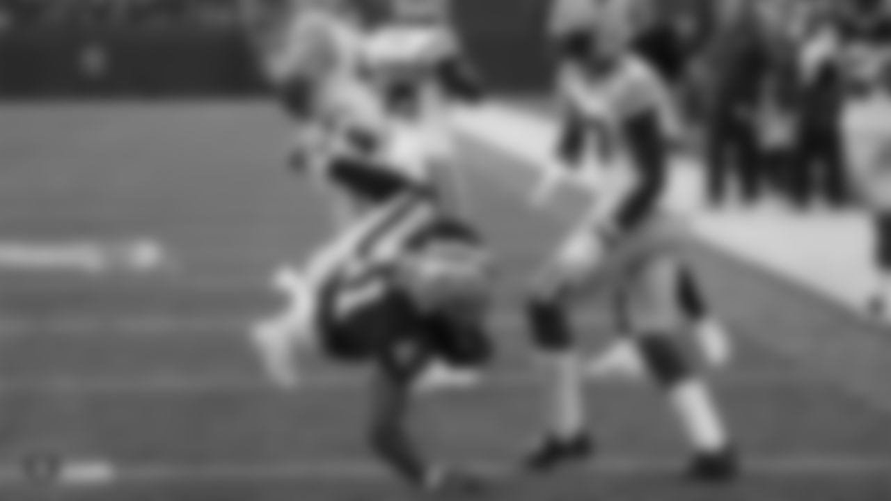 Raiders fullback Keith Smith (41) scores on a 15-yard touchdown catch during the Raiders preseason game against the Green Bay Packers at IG Field.
