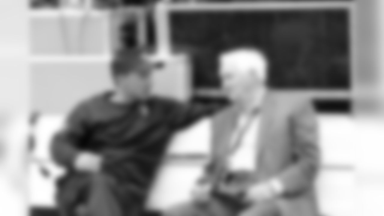 Head Coach Dennis Allen spends some time with Gil Brandt.
