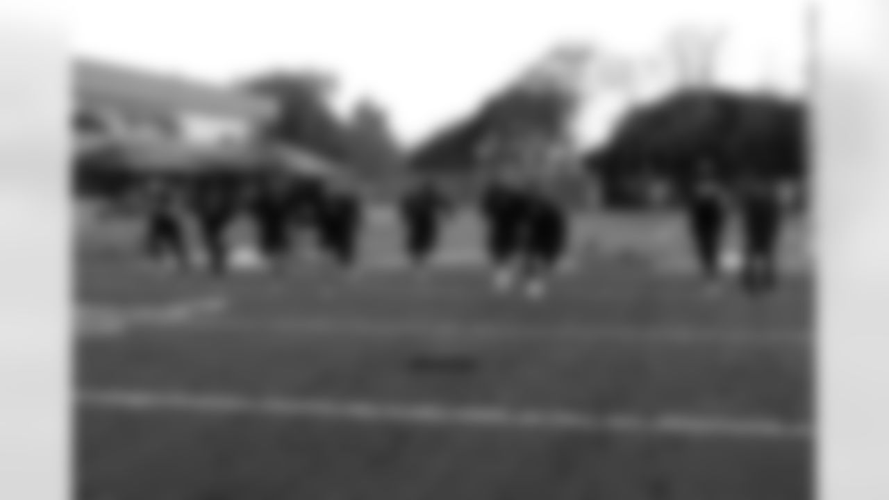 The offensive linemen take the field for sprints.