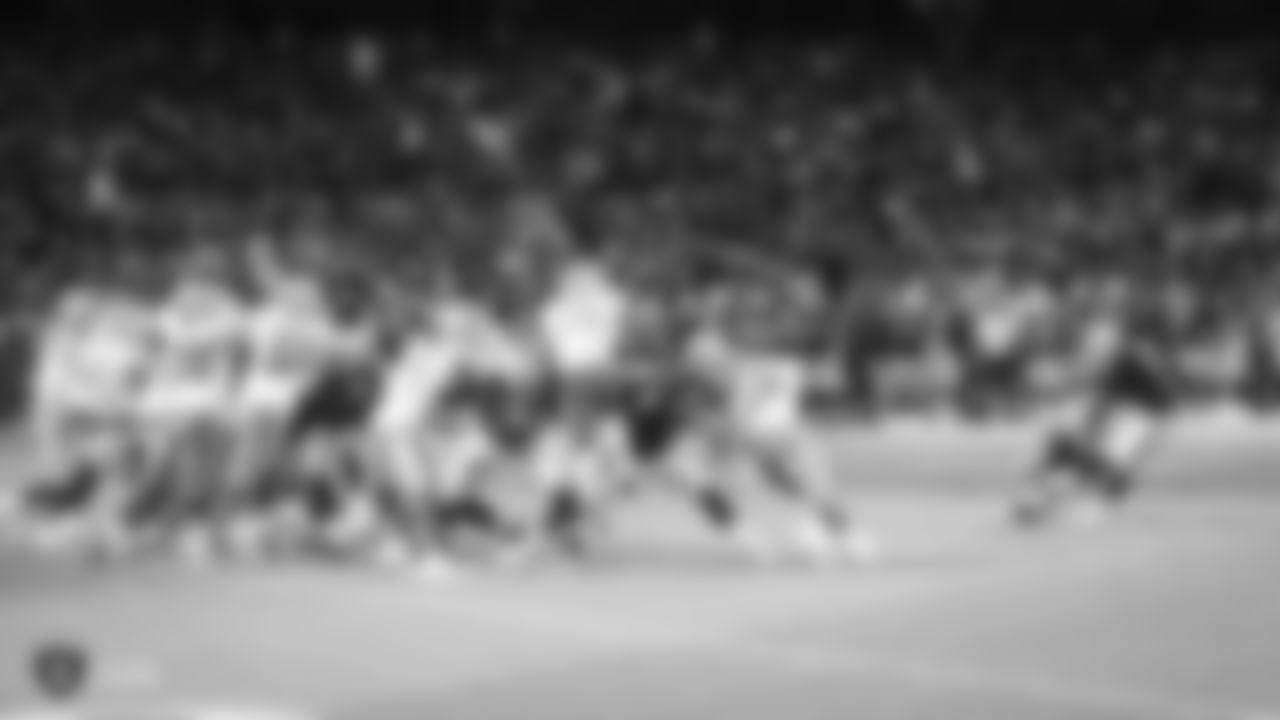 Oakland Raiders punter Johnny Townsend (5) holds for kicker Eddy Pi–eiro (9) during a field goal attempt during The Oakland Raiders preseason game against the Detroit Lions at Oakland-Alameda County Coliseum, Friday, August 10, 2018, in Oakland, California. The Oakland Raiders won 16-10.
