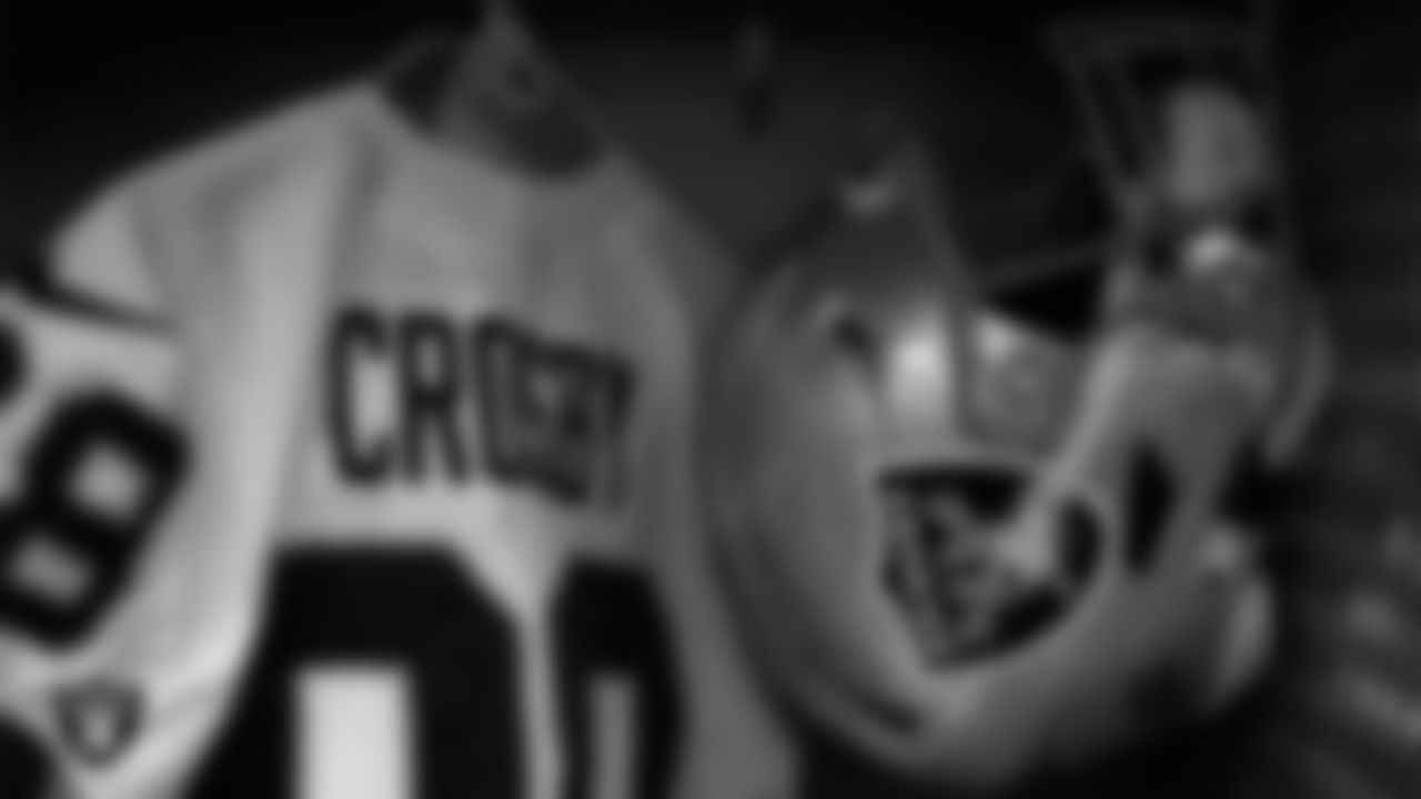 Las Vegas Raiders defensive end Maxx Crosby's (98) jersey and helmet in the locker room prior to the Las Vegas Raiders' arrival for their regular season away game against the Cleveland Browns.