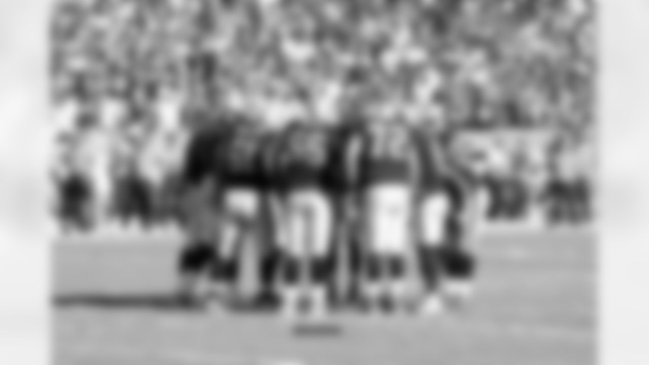 The offense huddles up and gets the play call from QB Derek Carr.