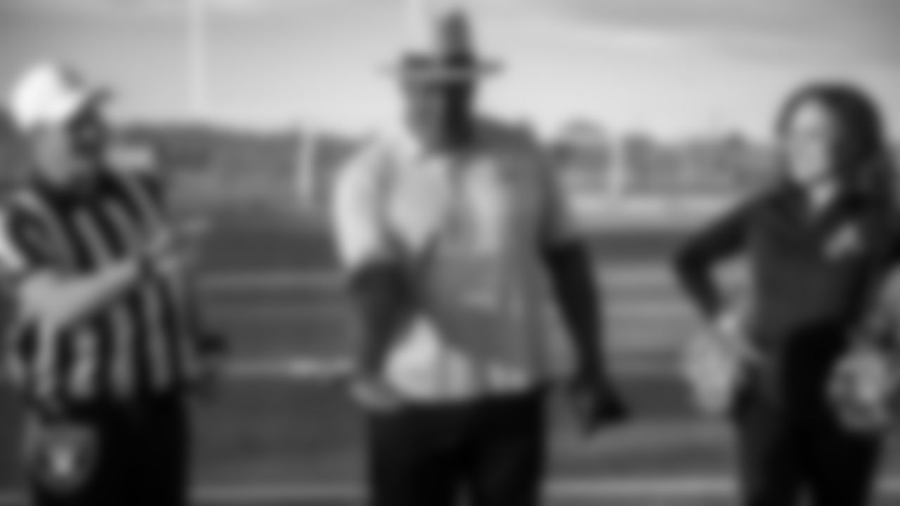 Las Vegas Raiders alumnus Roy Hart during the coin toss before the Basic High School girls flag football game.