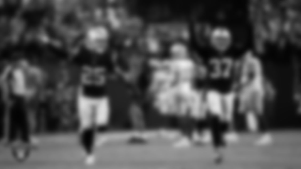 Las Vegas Raiders safety Tre'von Moehrig (25) and cornerback Tyler Hall (37) celebrate on the field during the regular season home game against the Green Bay Packers at Allegiant Stadium.
