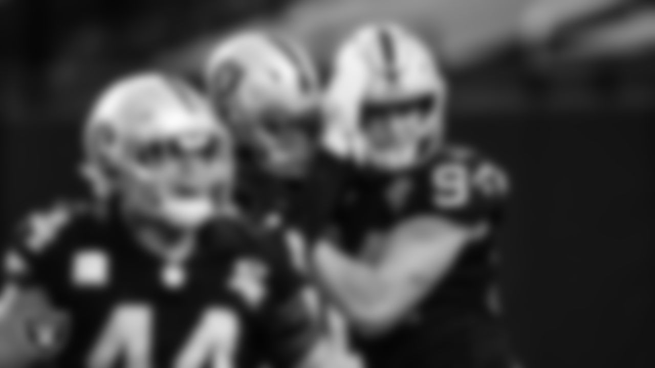 Las Vegas Raiders defensive end Carl Nassib (94) celebrates with defensive end Arden Key (99) after intercepting a pass during the regular season home game against the Denver Broncos.