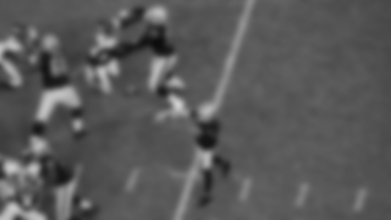 Las Vegas Raiders tackle Brandon Parker (75) guard Gabe Jackson (66), tackle Sam Young (70) and quarterback Derek Carr (4) during the regular season game against the Denver Broncos at Allegiant Stadium.