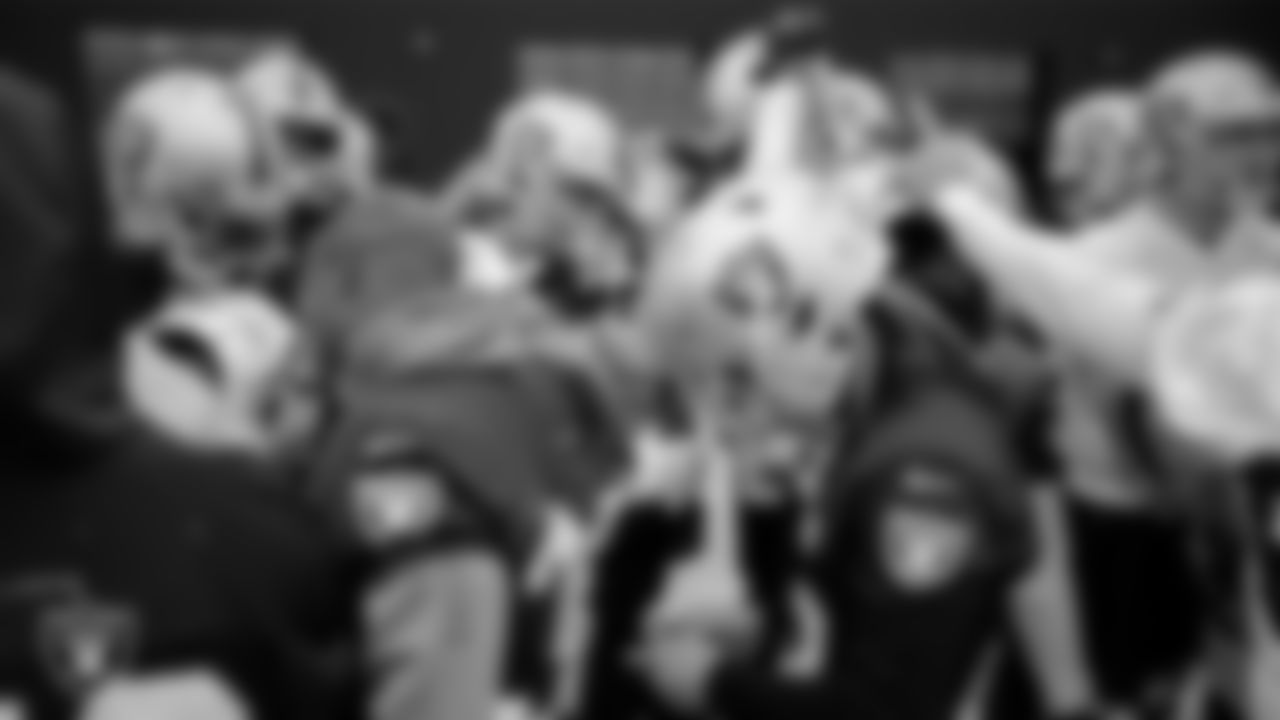 The Las Vegas Raiders huddle during practice at Intermountain Healthcare Performance Center.