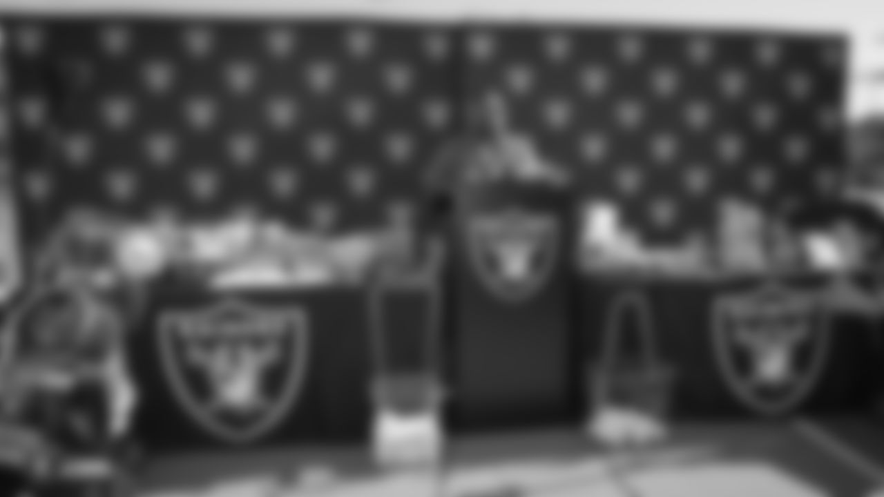 Oakland Raiders president, Marc Badain, and mother of Oakland Raiders running back Marshawn Lynch, Delisa Lynch, present a check of $250,000 to the Oakland Unified School District (OUSD) to help save sports that were eliminated due to budget cuts, at Oakland Technical High School, Friday, August 31, 2018, in Oakland, California.
