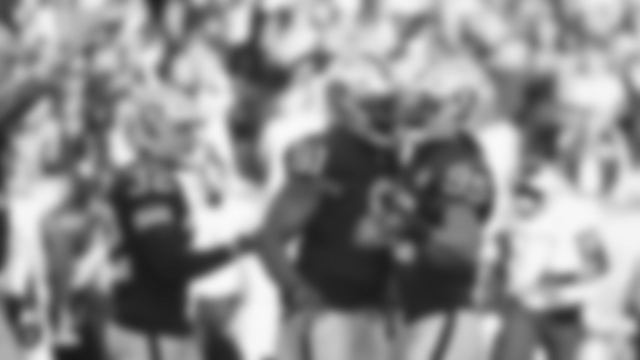 Raiders defensive end Benson Mayowa (91) and defensive end Dion Jordan (95) celebrate during the regular season game against the Jacksonville Jaguars.