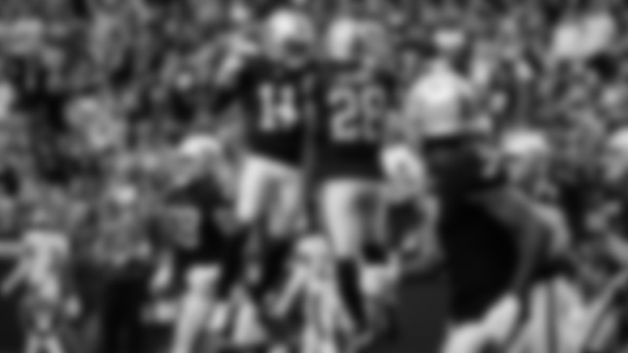 Las Vegas Raiders running back Josh Jacobs (28) celebrates with wide receiver Henry Ruggs III (11) after rushing for an 8-yard touchdown during the regular season home game against the Philadelphia Eagles.