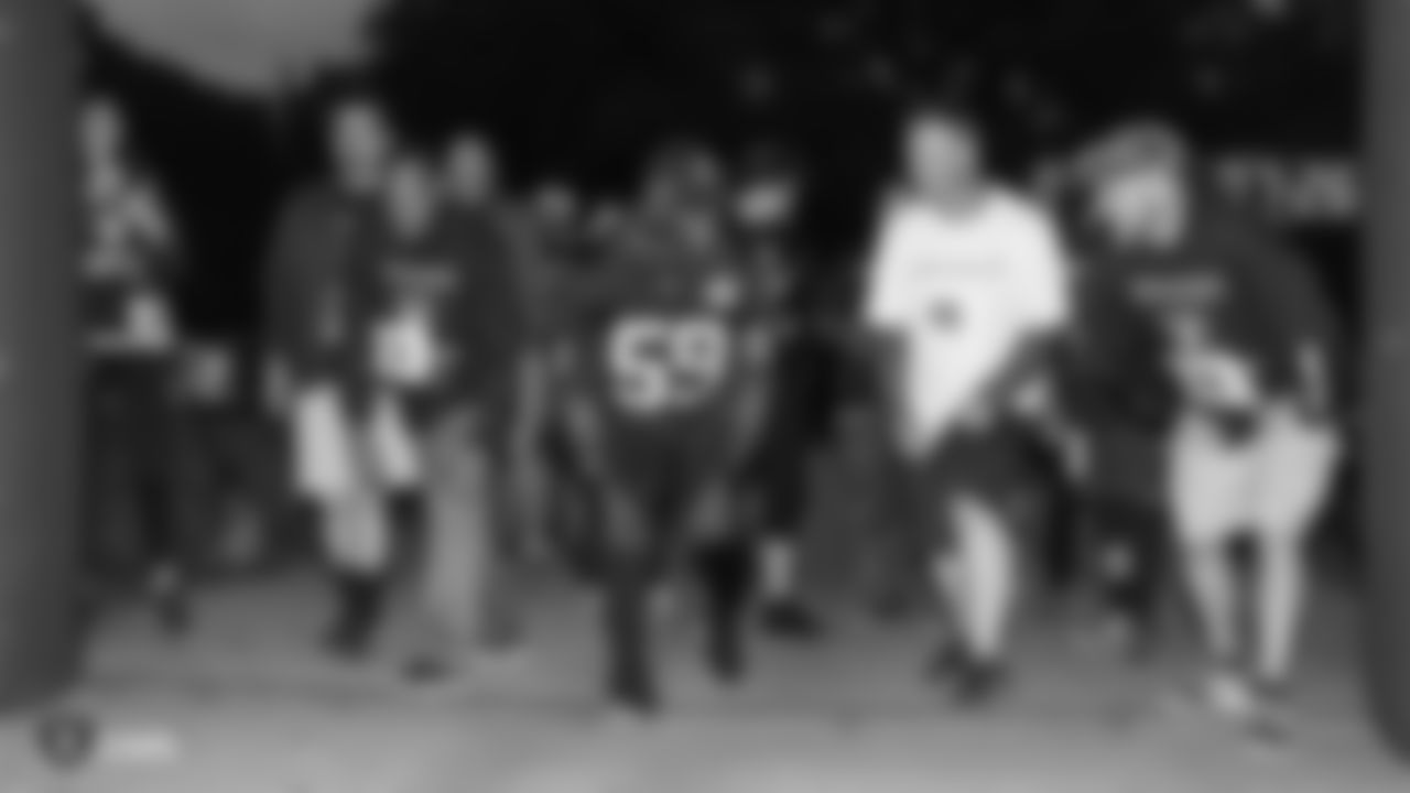 Raiders linebacker Tahir Whitehead (59) at the starting line with race participants at a Run Life's Course 5K run/walk and famous Grooves Dance Workout.