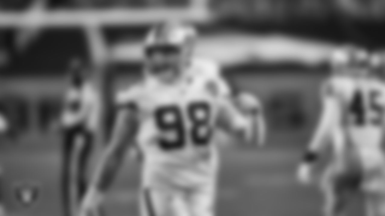 Las Vegas Raiders defensive end Maxx Crosby (98) celebrates after blocking a field goal during the regular season away game against the Denver Broncos.
