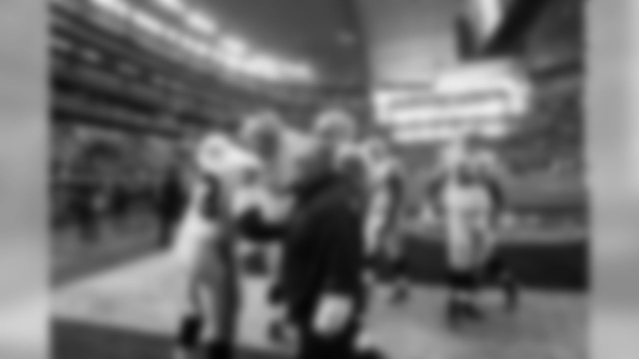 Offensive line coach Tony Sparano works with his unit pre-game.