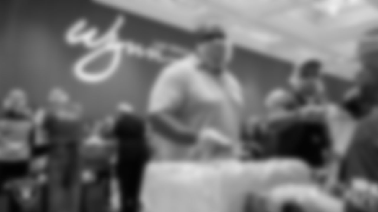Las Vegas Raiders alumnus Roy Hart packs meals during the Feed the Funnel Party at Wynn Resort.