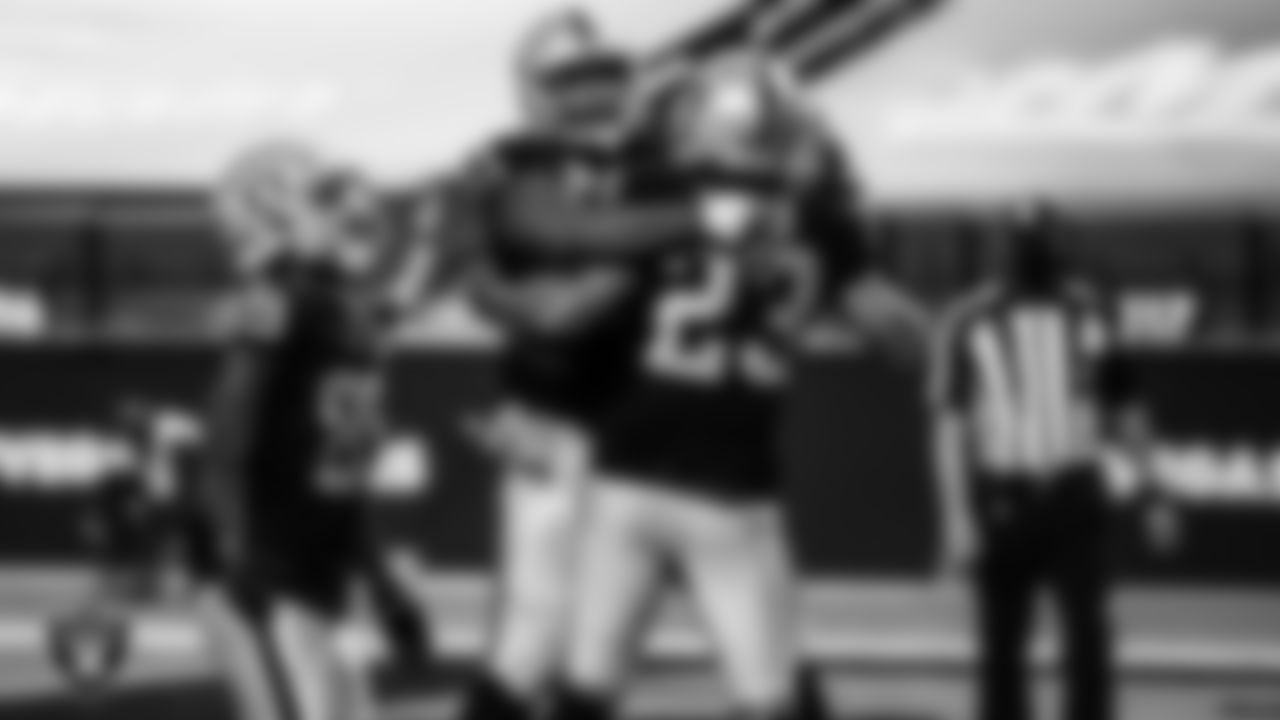 Las Vegas Raiders running back Devontae Booker (23) celebrates with teammates after rushing for a 23-yard touchdown during the regular season home game against the Denver Broncos.