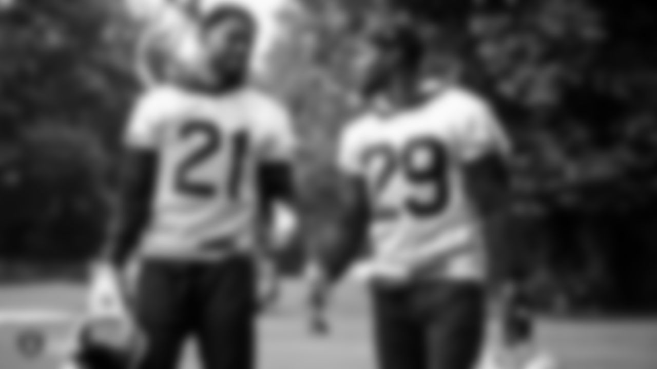 Raiders cornerback Gareon Conley (21) and safety Lamarcus Joyner (29) talk on the field during practice.