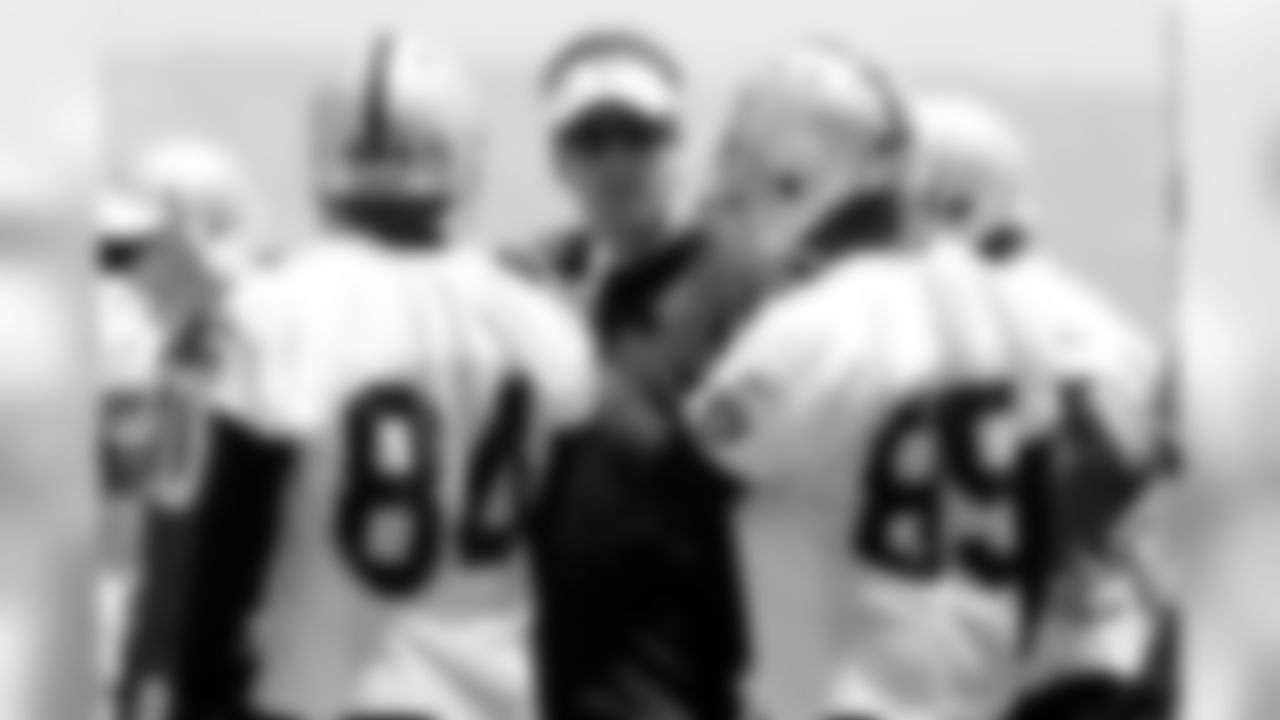 Offensive coordinator Greg Knapp works with the wide receivers.
