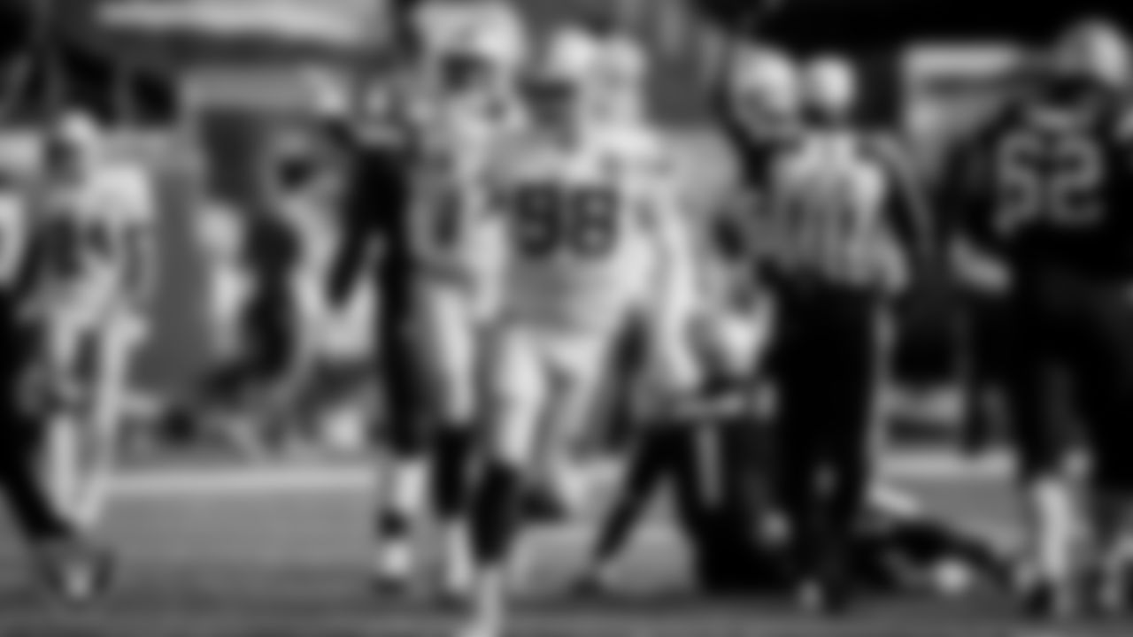 Las Vegas Raiders defensive end Maxx Crosby (98) celebrates after sacking the quarterback during the regular season away game against the New England Patriots.