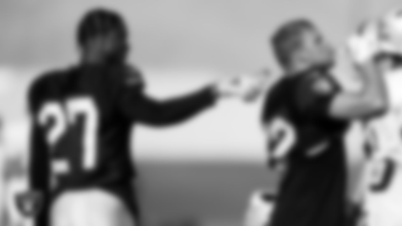 Las Vegas Raiders cornerback Trayvon Mullen Jr. (27) and safety Dallin Leavitt (32) on the field for practice at 2021 Training Camp.
