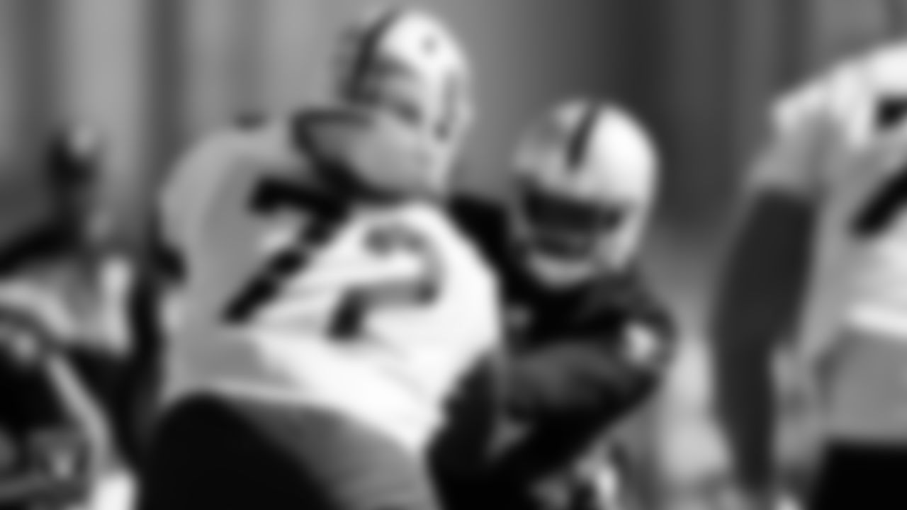Las Vegas Raiders offensive lineman Jermaine Eluemunor (72) and defensive end Clelin Ferrell (99) during practice at Intermountain Healthcare Performance Center.