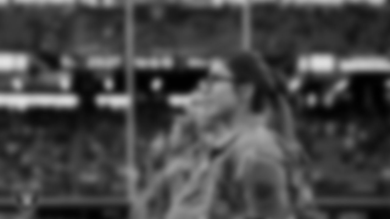Members of the United States Air Force take part in a reenlistment ceremony before the Las Vegas Raiders' regular season home game against the Cincinnati Bengals.