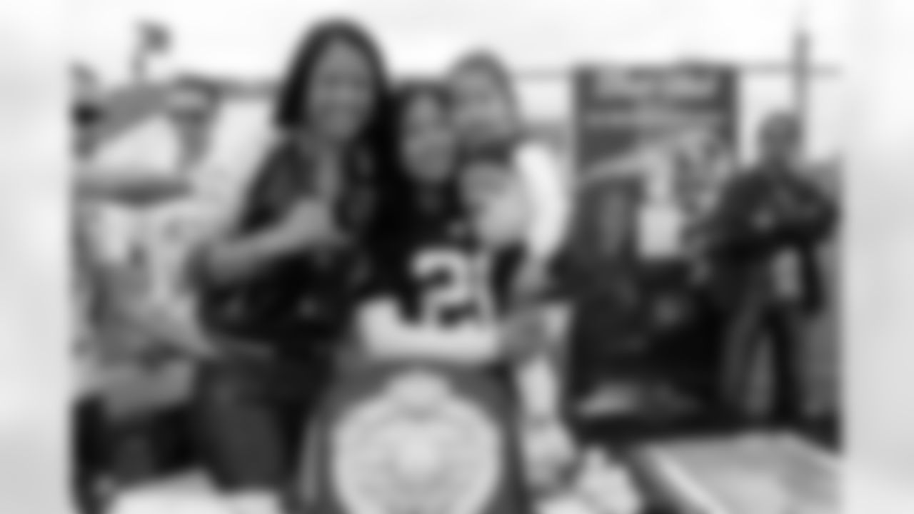 World Boxing Champion Ana "The Hurricane" Julaton poses for pictures with fans at Raiderville.
