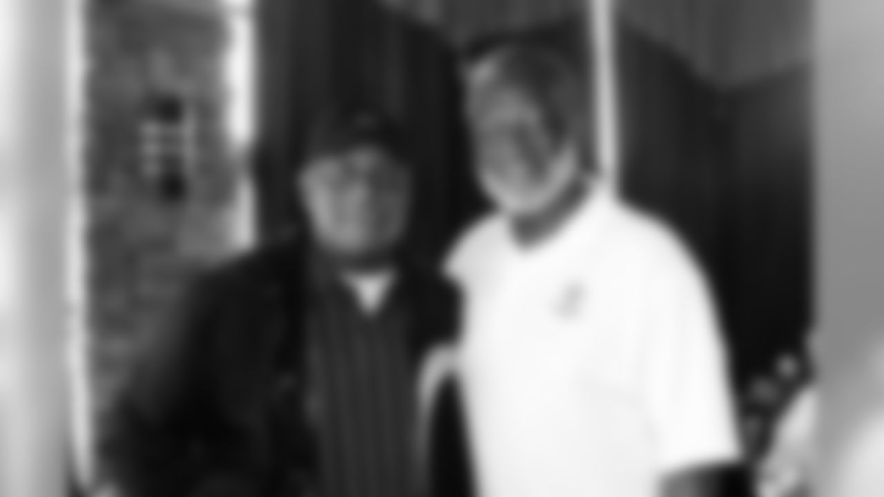 MacArthur Lane and Bobby Bell pose for a photo.