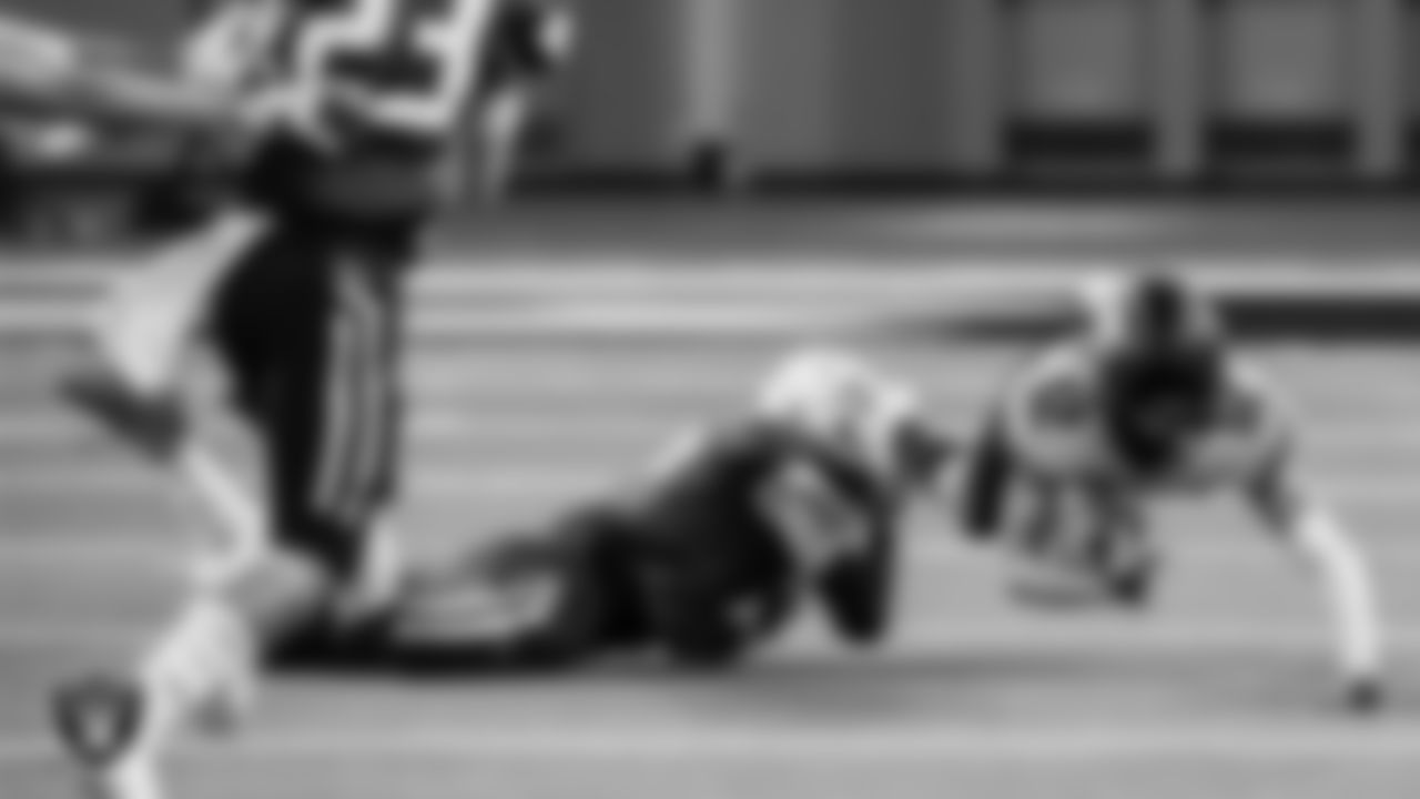 A Moapa Valley High School player tackles a Virgin Valley High School player during the NIAA Class 3A State Football Championship at Allegiant Stadium.