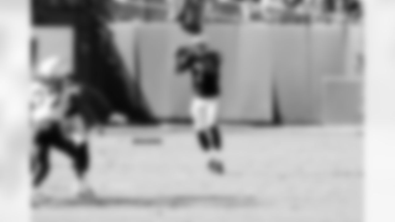 P Marquette King takes the snap to punt the ball away.