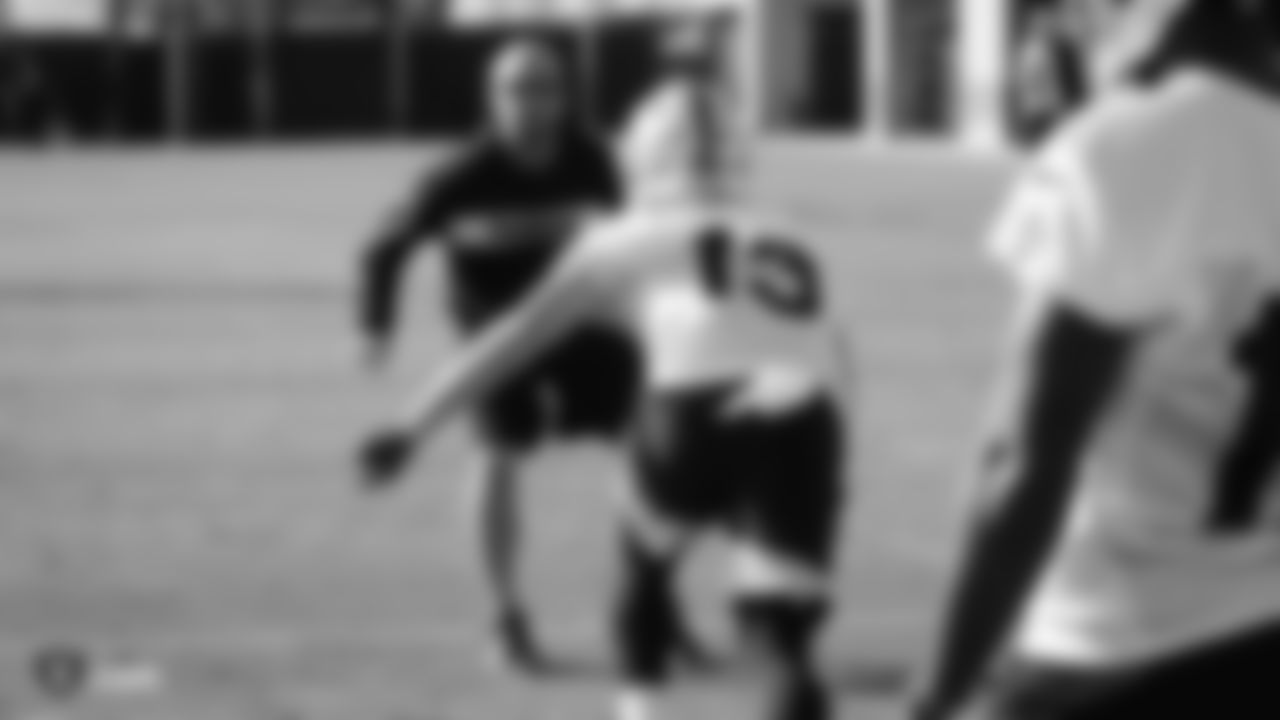Oakland Raiders offensive quality control coach Nick Holz goes through offensive drills with wide receiver Hunter Renfrow (13) during practice.