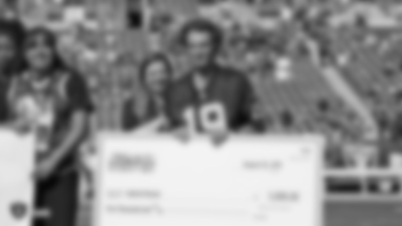 The Bay Area All-Stars Scholarship Team recipients are honored on the field before the Raiders preseason game against the Los Angeles Rams.