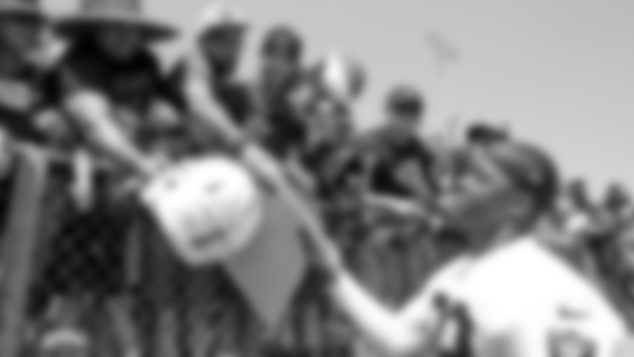 Oakland Raiders wide receiver Amari Cooper (89) signs autographs for fans after practice at 2018 Training Camp at Memorial Stadium, Saturday, July 28, 2018, in Napa, California.