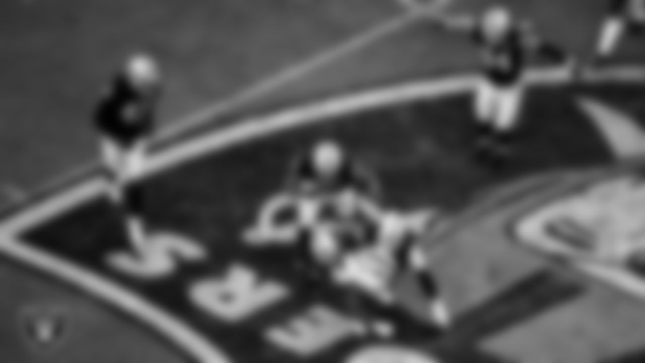 Las Vegas Raiders safety Lamarcus Joyner (29) and defensive end Clelin Ferrell (96) make a tackle during the regular season home game against the Buffalo Bills.